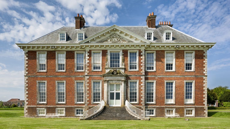 The south front of the main house showing the steps to the entrance at Uppark House and Garden